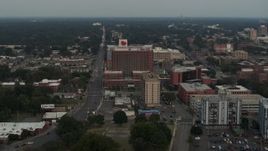 5.7K aerial stock footage of slowly flying away from a hospital at twilight in Memphis, Tennessee Aerial Stock Footage | DX0002_186_042