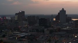 5.7K aerial stock footage of a reverse view of the city's downtown skyline at twilight, Downtown Memphis, Tennessee Aerial Stock Footage | DX0002_187_003