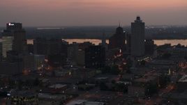 5.7K aerial stock footage approach and fly away from the city's downtown skyline at twilight, Downtown Memphis, Tennessee Aerial Stock Footage | DX0002_187_006