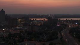 5.7K aerial stock footage of the Hernando de Soto Bridge, seen from Downtown Memphis, Tennessee at twilight Aerial Stock Footage | DX0002_187_010