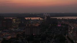 5.7K aerial stock footage a view of the Hernando de Soto Bridge, seen from Downtown Memphis, Tennessee at twilight Aerial Stock Footage | DX0002_187_011