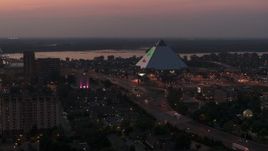 5.7K aerial stock footage of orbiting the Memphis Pyramid at twilight, Downtown Memphis, Tennessee Aerial Stock Footage | DX0002_187_013