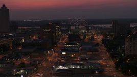 5.7K aerial stock footage of a light show on the Hernando de Soto Bridge at twilight, Downtown Memphis, Tennessee Aerial Stock Footage | DX0002_187_022