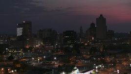 5.7K aerial stock footage ascend past downtown skyline at twilight, Downtown Memphis, Tennessee during descent Aerial Stock Footage | DX0002_187_024