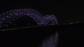 5.7K aerial stock footage of a stationary view of the bridge with purple lights at night, Memphis, Tennessee Aerial Stock Footage | DX0002_187_029