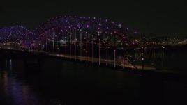 5.7K aerial stock footage of lights on the bridge at night, Downtown Memphis, Tennessee Aerial Stock Footage | DX0002_187_050