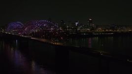 5.7K aerial stock footage of lights on the bridge at night near Downtown Memphis, Tennessee Aerial Stock Footage | DX0002_187_051
