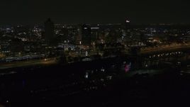 5.7K aerial stock footage of passing lights on the bridge at night to reveal Downtown Memphis, Tennessee Aerial Stock Footage | DX0002_187_053