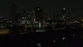 5.7K aerial stock footage ascend toward skyline and welcome center at night, Downtown Memphis, Tennessee Aerial Stock Footage | DX0002_187_055