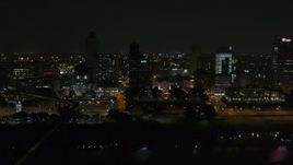 5.7K aerial stock footage orbit around the city's downtown skyline at night, Downtown Memphis, Tennessee Aerial Stock Footage | DX0002_187_061