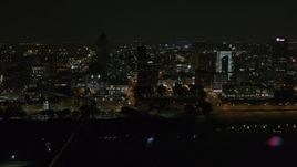 5.7K aerial stock footage of orbiting the city's downtown skyline at nighttime, Downtown Memphis, Tennessee Aerial Stock Footage | DX0002_187_069