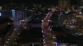 5.7K aerial stock footage of flying by Beale Street at nighttime, Downtown Memphis, Tennessee Aerial Stock Footage | DX0002_188_001