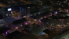 5.7K aerial stock footage of orbiting the Beale Street intersection at nighttime, Downtown Memphis, Tennessee Aerial Stock Footage | DX0002_188_004