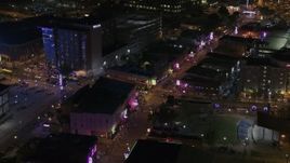 5.7K aerial stock footage of bright lights and signs down Beale Street at nighttime, Downtown Memphis, Tennessee Aerial Stock Footage | DX0002_188_006