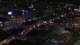 5.7K aerial stock footage of flying by bright lights and signs on Beale Street at nighttime, Downtown Memphis, Tennessee Aerial Stock Footage | DX0002_188_007