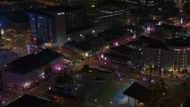 5.7K aerial stock footage orbit and fly away from Beale Street intersection at nighttime, Downtown Memphis, Tennessee Aerial Stock Footage | DX0002_188_009