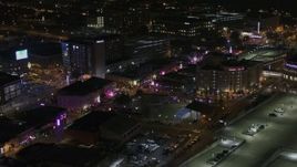 5.7K aerial stock footage of circling a Beale Street intersection at nighttime, Downtown Memphis, Tennessee Aerial Stock Footage | DX0002_188_010