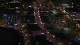 5.7K aerial stock footage of colorful lights and signs on Beale Street at nighttime, Downtown Memphis, Tennessee Aerial Stock Footage | DX0002_188_011