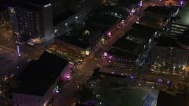 5.7K aerial stock footage a busy Beale Street intersection at nighttime, Downtown Memphis, Tennessee Aerial Stock Footage | DX0002_188_014