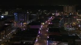 5.7K aerial stock footage of orbiting busy Beale Street at nighttime, Downtown Memphis, Tennessee Aerial Stock Footage | DX0002_188_017