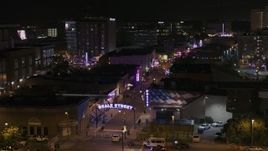 5.7K aerial stock footage of flying by the Beale Street sign at nighttime, Downtown Memphis, Tennessee Aerial Stock Footage | DX0002_188_020