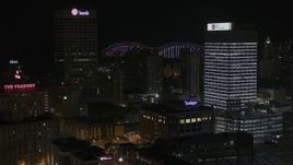 5.7K aerial stock footage of city buildings between office towers at nighttime, Downtown Memphis, Tennessee Aerial Stock Footage | DX0002_188_022