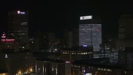 5.7K aerial stock footage of fly away from First Tennessee Building at nighttime and descend, Downtown Memphis, Tennessee Aerial Stock Footage | DX0002_188_026