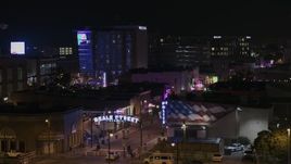 5.7K aerial stock footage of orbiting the Beale Street sign at nighttime, Downtown Memphis, Tennessee Aerial Stock Footage | DX0002_188_027