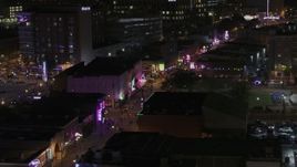 5.7K aerial stock footage flyby clubs and restaurants on Beale Street at nighttime, Downtown Memphis, Tennessee Aerial Stock Footage | DX0002_188_035