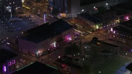 5.7K aerial stock footage orbit clubs and restaurants on Beale Street at nighttime, Downtown Memphis, Tennessee Aerial Stock Footage | DX0002_188_036