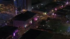 5.7K aerial stock footage of circling clubs and restaurants on Beale Street at nighttime, Downtown Memphis, Tennessee Aerial Stock Footage | DX0002_188_037