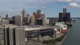 5.7K aerial stock footage fly away from the arena and skyline, reveal apartment towers, Downtown Detroit, Michigan Aerial Stock Footage | DX0002_189_007