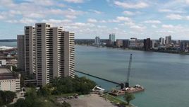 5.7K aerial stock footage the Windsor, Ontario skyline across the river, seen from Downtown Detroit, Michigan Aerial Stock Footage | DX0002_189_014