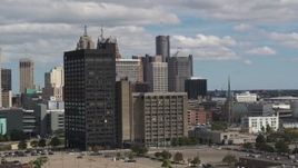 5.7K aerial stock footage descend and flyby office buildings, skyline in the distance, Downtown Detroit, Michigan Aerial Stock Footage | DX0002_189_035