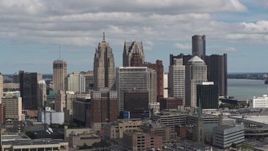 5.7K aerial stock footage ascend and focus on towering skyscrapers, Downtown Detroit, Michigan Aerial Stock Footage | DX0002_189_037