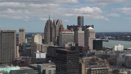 5.7K aerial stock footage a reverse view of towering skyscrapers, Downtown Detroit, Michigan Aerial Stock Footage | DX0002_189_038