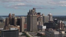 5.7K aerial stock footage passing by the Patrick V. McNamara Federal Building and skyscrapers, Downtown Detroit, Michigan Aerial Stock Footage | DX0002_189_042