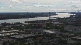 5.7K aerial stock footage of the Ambassador Bridge spanning the Detroit River, Detroit, Michigan Aerial Stock Footage | DX0002_190_005