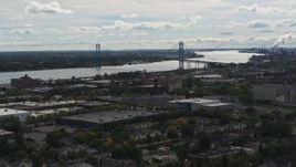 5.7K aerial stock footage of the Ambassador Bridge spanning the Detroit River while descending, Detroit, Michigan Aerial Stock Footage | DX0002_190_006