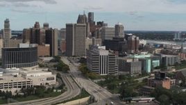 5.7K aerial stock footage flyby and approach a federal building and skyscrapers, Downtown Detroit, Michigan Aerial Stock Footage | DX0002_190_010