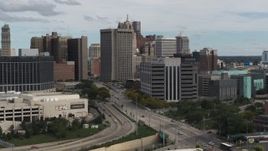 5.7K aerial stock footage fly away from downtown police headquarters and descend, Downtown Detroit, Michigan Aerial Stock Footage | DX0002_190_016