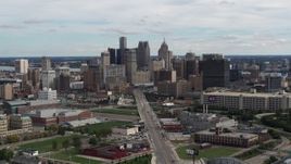5.7K aerial stock footage of flying by the towering skyscrapers in the city's skyline, Downtown Detroit, Michigan Aerial Stock Footage | DX0002_190_019