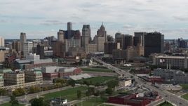 5.7K aerial stock footage descend past the towering skyscrapers in the downtown skyline, Downtown Detroit, Michigan Aerial Stock Footage | DX0002_190_023