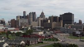 5.7K aerial stock footage ascending past the giant towers in the downtown skyline, Downtown Detroit, Michigan Aerial Stock Footage | DX0002_190_028
