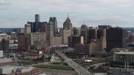 5.7K aerial stock footage passing by tall skyscrapers in the city's skyline, Downtown Detroit, Michigan Aerial Stock Footage | DX0002_190_030