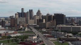5.7K aerial stock footage descend past tall skyscrapers in the city's skyline, Downtown Detroit, Michigan Aerial Stock Footage | DX0002_190_031