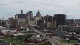 5.7K aerial stock footage ascend from Grand River Avenue, view of the city's skyline, Downtown Detroit, Michigan Aerial Stock Footage | DX0002_190_033