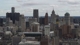 5.7K aerial stock footage slowly descending past the city's downtown skyline, Downtown Detroit, Michigan Aerial Stock Footage | DX0002_190_040