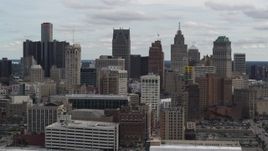 5.7K aerial stock footage the city's downtown skyline seen while descending near arena, Downtown Detroit, Michigan Aerial Stock Footage | DX0002_190_042