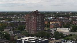5.7K aerial stock footage of orbiting a brick apartment building, Detroit, Michigan Aerial Stock Footage | DX0002_190_046